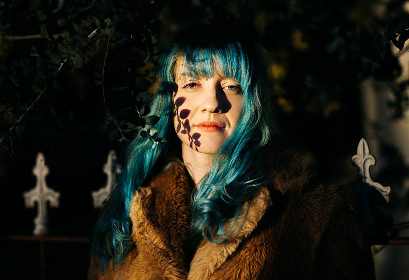 Portrait image of model with green hair taken by Kate Cornish
