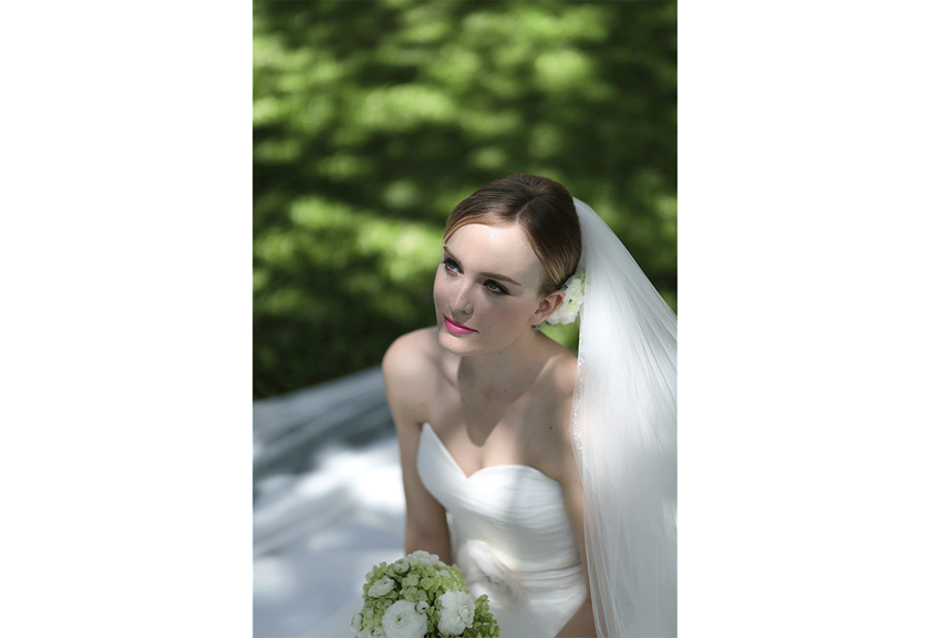 Portrait image of bride sitting down