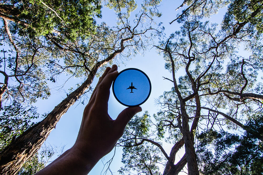 Point of view photograph of toy plane frisbee with sky in background