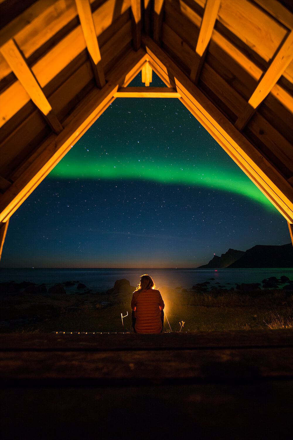 Image of a person under the Northern Lights
