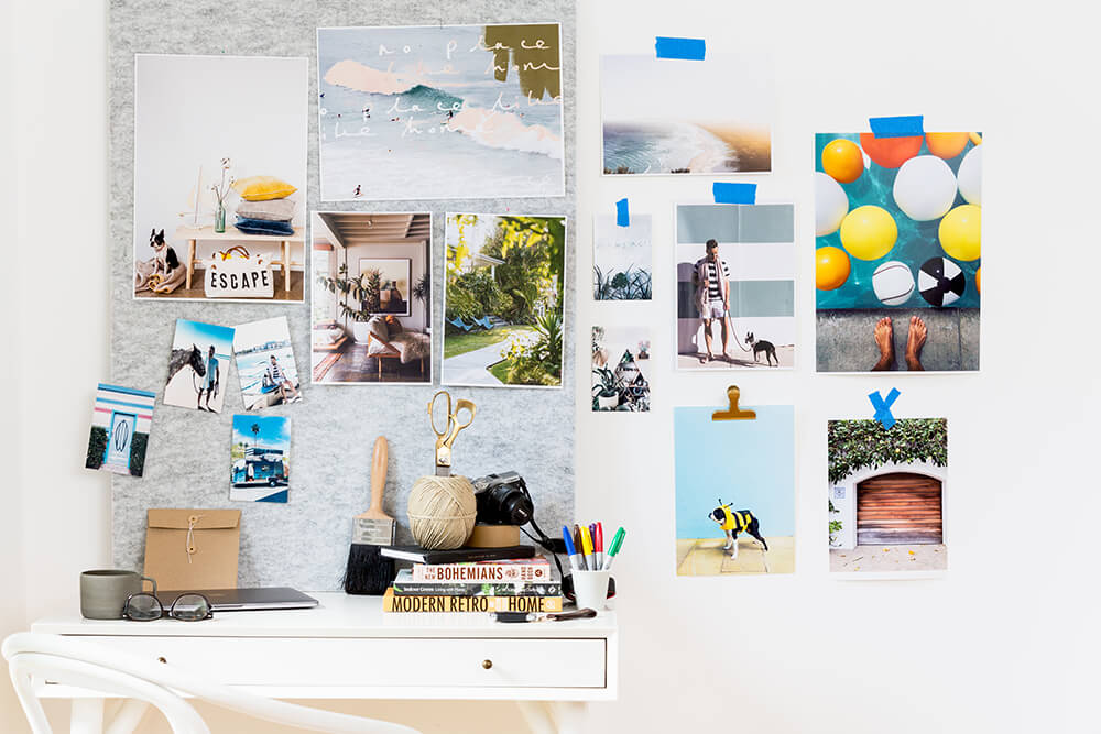 home office set up with images printed on wall