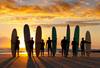 Image of surfboarders silhouette in the beach