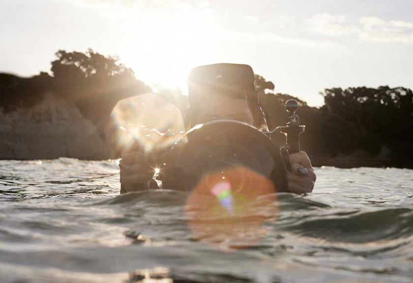 Image of Magenta Hyde with her snorkeling gear and underwater camera