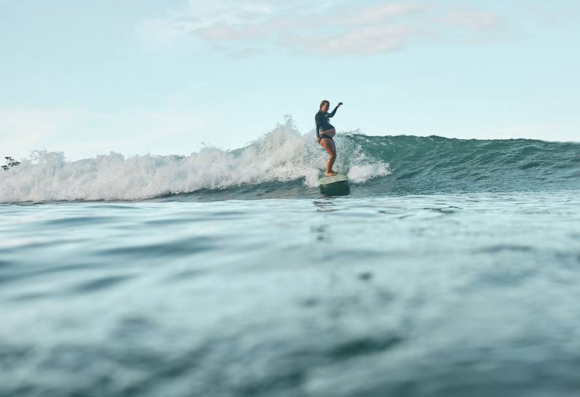 Image of Mischa Davis surfing waves