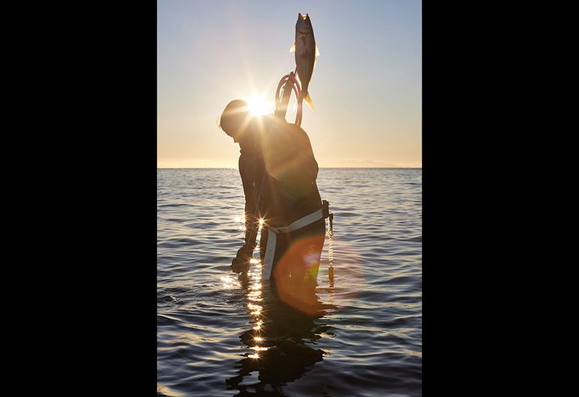 Image of Sophie Hamilton catching a fish