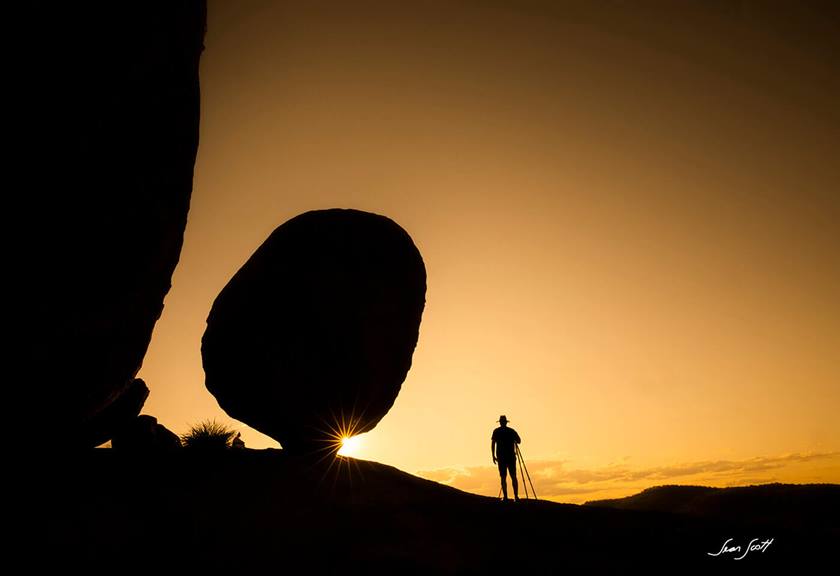 Image of a man next to a big rock by Canon Master Sean Scott