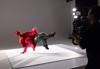 Image of a dancer in red outfit breakdancing