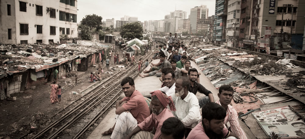 image of Bangladeshi people on the roof of a train